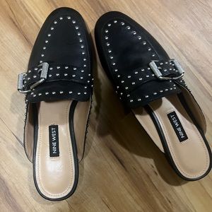 Nine wear Mules, worn for event, black with silver studs.